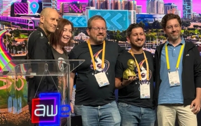 Eduardo and Alberto Saldaña, founders of Sons of the Bit, with part of their team receiving the Auggie award for best augmented reality videogame | Image courtesy of Sons of a Bit.